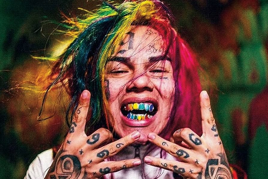 6ix9ine Draws A Comparison Between His Latest Musical Release And The Work Of Fellow Artist Travis Scott